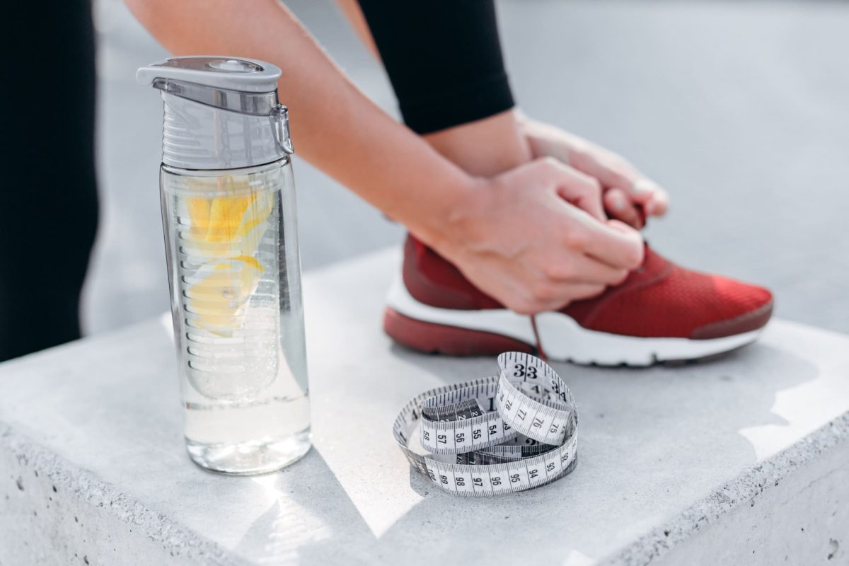 closeup-glass-bottle-of-water-with-lemon-and-tape-2021-09-23-20-28-18-utc